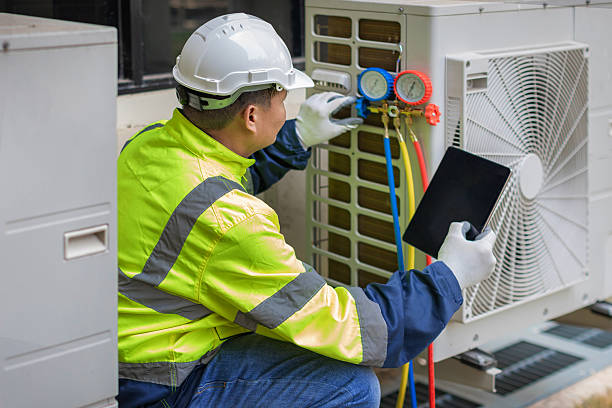 Professional Air Duct Cleaning technician working in Holland, MI